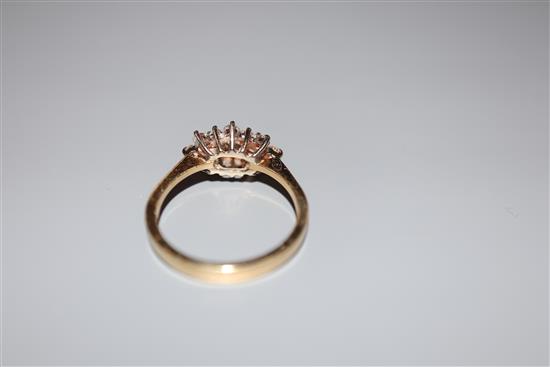 A modern 18ct gold and diamond cluster ring, size M, gross 3.2 grams.